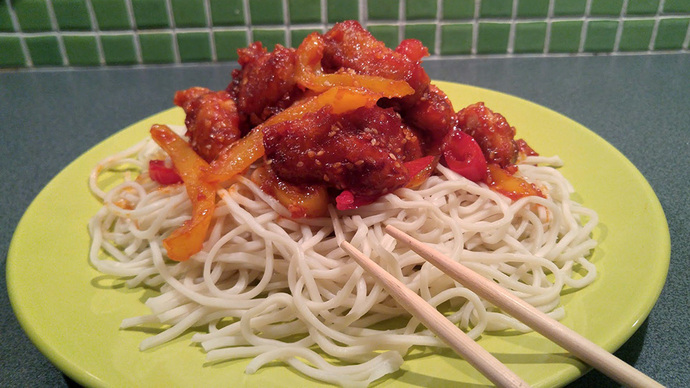 From Eastern Cuisine: Honey Chicken Pieces with Vegetables and Sesame